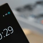 Focused image of a smartphone showing a 10:29 time with blurred background.