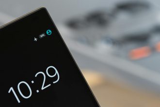 Focused image of a smartphone showing a 10:29 time with blurred background.